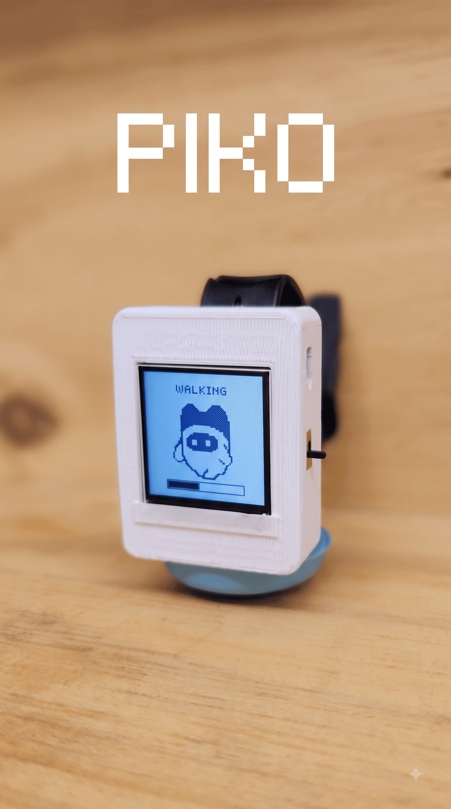 PIKO wearable companion with a tiny screen showing a walking character